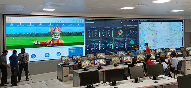 1. Tổng Quan Dự Án Smart City Dubai
Màn hình LED trung tâm điều hành Colorlight được triển khai tại Trung tâm Giám sát Đô thị Thông minh Dubai nhằm phục vụ quản lý giao thông, an ninh và hạ tầng thành phố theo thời gian thực. Dubai là một trong những thành phố tiên phong toàn cầu về chuyển đổi số đô thị, nơi hàng triệu dữ liệu được thu thập từ camera, cảm biến giao thông, IoT môi trường và hệ thống an ninh mỗi phút.
Trong bối cảnh đó, màn hình LED trung tâm điều hành Colorlight đóng vai trò là “bề mặt hiển thị chiến lược”, nơi toàn bộ dữ liệu được trực quan hóa để hỗ trợ ra quyết định nhanh chóng và chính xác. Hệ thống sử dụng nền tảng điều khiển chuyên nghiệp từ Colorlight nhằm đảm bảo khả năng xử lý đa nguồn tín hiệu với độ trễ cực thấp.
Ngay từ giai đoạn thiết kế, màn hình LED trung tâm điều hành Colorlight đã được xác định là thành phần cốt lõi trong kiến trúc Smart City 4.0 của Dubai.
2. Vai Trò Của Màn Hình LED Trung Tâm Điều Hành Colorlight
4
Trong trung tâm điều hành, màn hình LED trung tâm điều hành Colorlight hiển thị đồng thời:
Camera giao thông 4K
Bản đồ ùn tắc theo thời gian thực
Chỉ số môi trường (AQI, nhiệt độ, độ ẩm)
Cảnh báo an ninh
Dữ liệu cảm biến IoT
Thay vì vận hành qua nhiều màn hình rời rạc, toàn bộ thông tin được tích hợp vào một video wall khổ lớn, giúp đội ngũ điều hành có cái nhìn tổng thể trong một khung hình duy nhất.
Khả năng chia đa cửa sổ linh hoạt giúp hiển thị nhiều lớp dữ liệu mà vẫn đảm bảo độ rõ nét và đồng đều màu sắc.
3. Cấu Hình Hệ Thống
Hệ thống màn hình LED trung tâm điều hành Colorlight tại Dubai có diện tích 240m², sử dụng pixel pitch P1.5 indoor để đảm bảo độ chi tiết cao khi quan sát ở khoảng cách gần.
Độ phân giải tổng đạt 8K, cho phép hiển thị đồng thời nhiều nguồn tín hiệu 4K mà không suy giảm chất lượng. Công nghệ HDR giúp tăng dải tương phản, đảm bảo chi tiết rõ ràng trong cả vùng sáng và vùng tối.
Hệ thống được trang bị:
Grayscale 16-bit
Tần số quét ≥3840Hz
Dual signal redundancy
Dual power supply
Nhờ cơ chế dự phòng kép, màn hình LED trung tâm điều hành Colorlight vận hành liên tục 24/7 mà không gián đoạn.
4. 10 Giá Trị Cốt Lõi Khi Triển Khai
Thứ nhất, trực quan hóa dữ liệu giao thông theo thời gian thực.
Thứ hai, giảm thời gian phản ứng khi xảy ra tai nạn.
Thứ ba, hỗ trợ phân tích xu hướng ùn tắc.
Thứ tư, tích hợp AI dự đoán lưu lượng.
Thứ năm, giám sát an ninh tập trung.
Thứ sáu, quản lý hạ tầng điện – nước – môi trường.
Thứ bảy, tối ưu nguồn lực điều phối.
Thứ tám, nâng cao hiệu quả họp chiến lược.
Thứ chín, giảm chi phí bảo trì dài hạn.
Thứ mười, tạo nền tảng Smart City bền vững.
5. Tích Hợp IoT Và AI
Màn hình LED trung tâm điều hành Colorlight tích hợp dữ liệu từ hàng nghìn cảm biến IoT. AI phân tích dữ liệu giao thông và dự đoán điểm nghẽn trước khi xảy ra ùn tắc nghiêm trọng.
Tham khảo thêm về xu hướng Smart City toàn cầu tại:
👉 <a href="https://www.weforum.org/agenda/archive/smart-cities/" rel="dofollow">World Economic Forum – Smart Cities</a>
6. Ứng Dụng Thực Tế
Hệ thống được đặt tại:
Trung tâm giám sát giao thông
Phòng điều hành an ninh
Phòng họp chiến lược đô thị
Màn hình LED trung tâm điều hành Colorlight giúp giảm 30% thời gian xử lý sự cố giao thông và nâng cao hiệu quả quản lý đô thị.
7. So Sánh LED Và LCD Video Wall
So với LCD, LED fine pitch không có viền ghép, độ sáng cao hơn và tuổi thọ vượt trội (>100.000 giờ). Điều này giúp hình ảnh liền mạch và ổn định hơn trong môi trường điều hành 24/7.
8. Kết Luận
Màn hình LED trung tâm điều hành Colorlight tại Dubai là minh chứng cho khả năng ứng dụng công nghệ LED vào quản lý đô thị thông minh. Với cấu hình 8K, P1.5 fine pitch và hệ thống dự phòng kép, giải pháp này đảm bảo hiển thị chính xác, vận hành liên tục và hỗ trợ ra quyết định chiến lược.